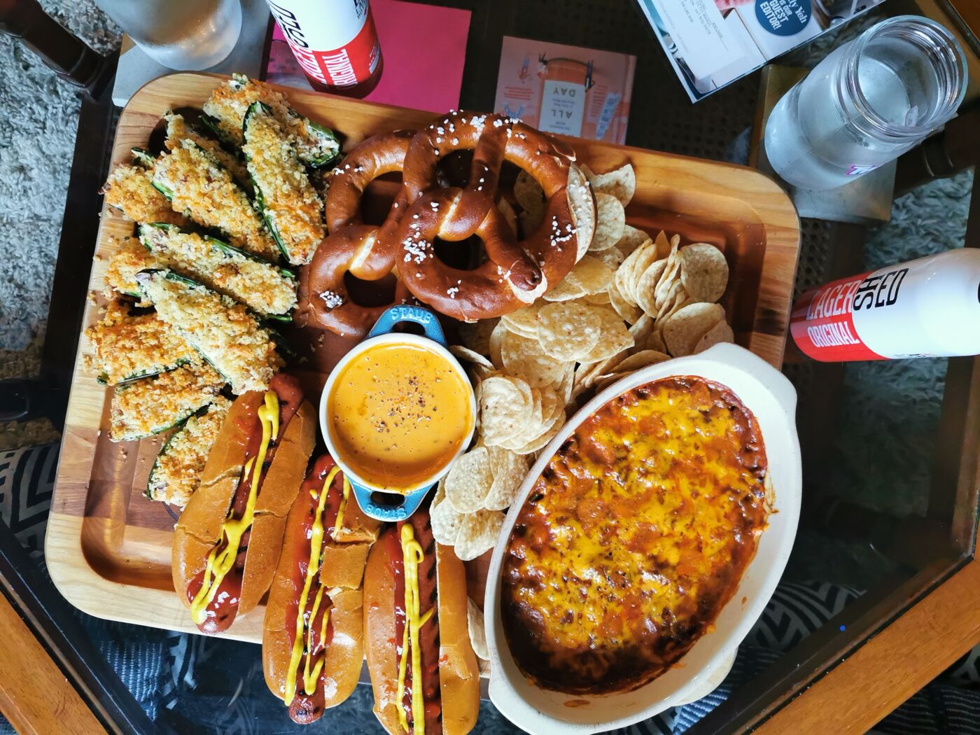 game day snackplatter with cheesy jalapeno poppers, pretzels, hot dogs and chili cheese dip